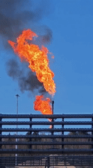Gas flares burn at Russian industrial facility, produce smoke
