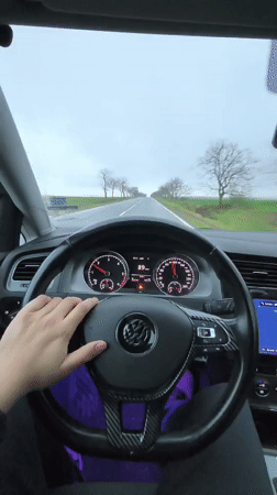 Driver travels rural road near Troyanovo, Bulgaria