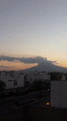 Sunset over mountain range viewed from Mexican neighborhood