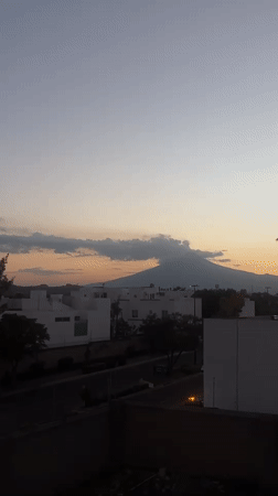 Sunset over mountain range viewed from Mexican neighborhood