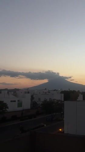 Sunset over mountain range viewed from Mexican neighborhood