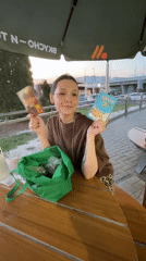 Woman enjoys outdoor meal with fast food in Kazan