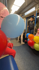 Balloons take over a Moscow Metro car