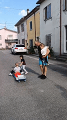 Family gathering with pets on Viadana street