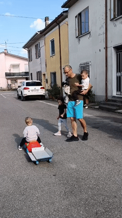 Family gathering with pets on Viadana street