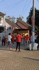 Neighborhood event in Galak brings out coordinated crowd in red