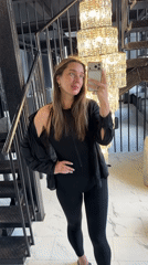 Woman takes selfies in upscale Podolsk building interior