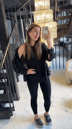 Woman takes selfies in upscale Podolsk building interior