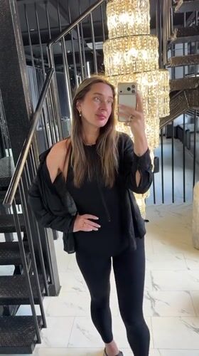 Woman takes selfies in upscale Podolsk building interior