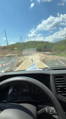 Van navigates a dusty construction road near Kresna, Bulgaria