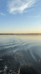 Sunset lake gathering captured in Votkinsk during peaceful afternoon