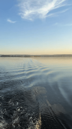 Sunset lake gathering captured in Votkinsk during peaceful afternoon