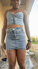 Woman takes selfies, poses outdoors in Jalingo, Nigeria