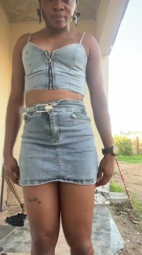 Woman takes selfies, poses outdoors in Jalingo, Nigeria