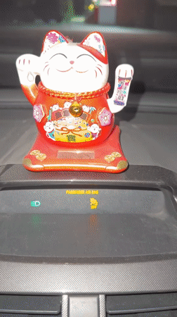 Lucky Cat Dashboard Ornament Spotted in Tashkent Vehicle