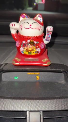 Lucky Cat Dashboard Ornament Spotted in Tashkent Vehicle