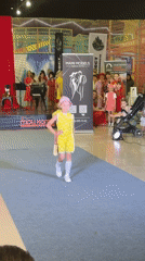 Indoor fashion show on a blue carpet runway, Astrakhan area