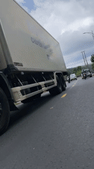 Morning traffic observed on mountain road in Vietnam