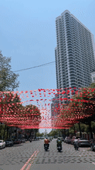 Red flags decorate street in Nha Trang, Vietnam