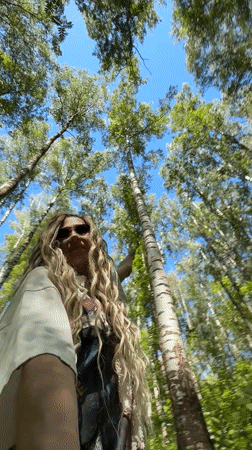 Woman filmed walking through forest in Rusanovo, Russia