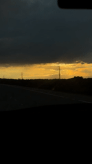 Highway sunset drive captured through car windows and mirrors