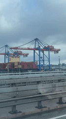 Morning traffic passes Hamburg container port during operations