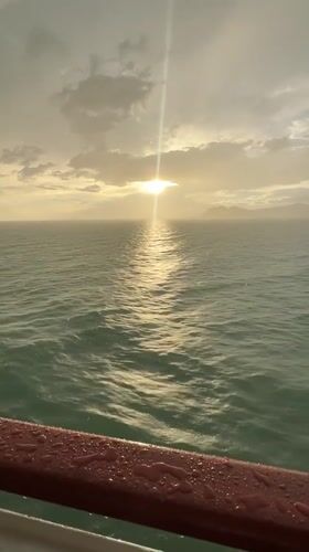 Ferry crossing from Don Sak with a puppy and Gulf sunset views