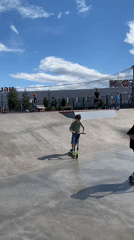 Afternoon scooter session at a graffiti bowl skatepark in Shushary