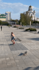 Skateboarder lands tricks at Yekaterinburg plaza during afternoon session