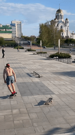 Skateboarder lands tricks at Yekaterinburg plaza during afternoon session