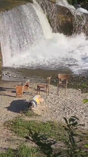 Waterfall scene with scattered furniture observed in Blagoevgrad, Bulgaria