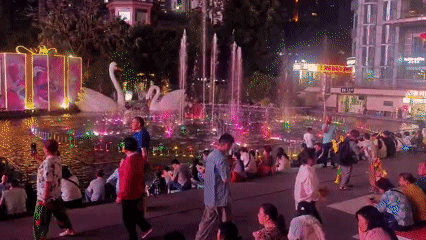Evening street life captured across Liangjiang district plazas