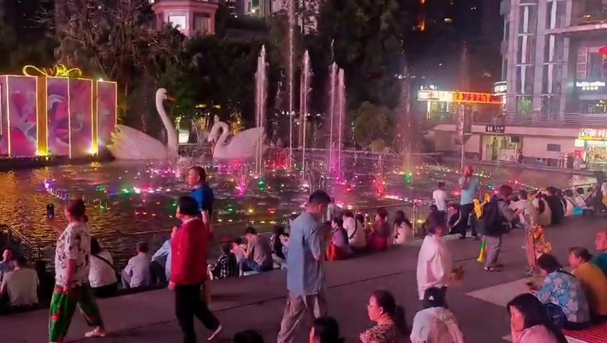 Evening street life captured across Liangjiang district plazas