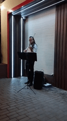 Outdoor violin performance at a modern venue in Bender, Moldova