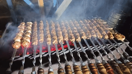 Evening kebab grilling session documented in Nizhnevartovsk, Russia