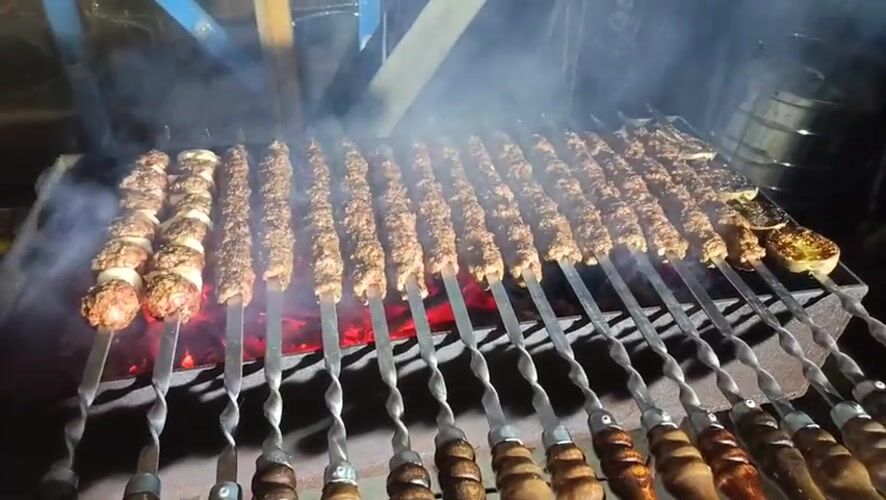 Evening kebab grilling session documented in Nizhnevartovsk, Russia