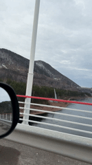 Scenic river landscape filmed from moving vehicle in Divnogorsk