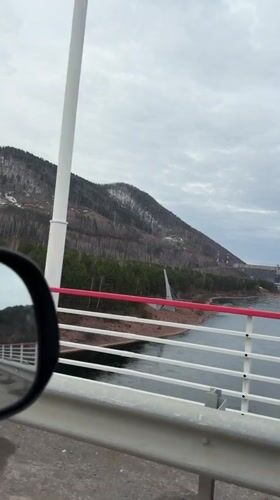 Scenic river landscape filmed from moving vehicle in Divnogorsk