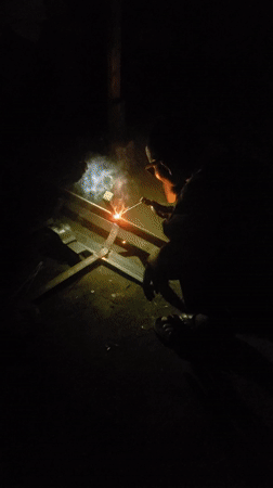 Welding work documented in dark setting in Adankolo, Nigeria