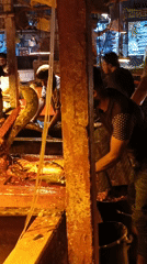 Fish vendors conduct regular business at Dhaka market