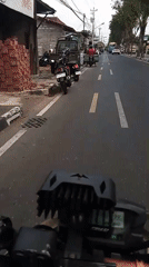 Motorcycle POV ride through a Yogyakarta street