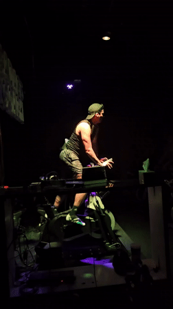 Man performs in dimly lit venue in Puebla