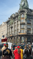 Parade marches past Singer House in Saint Petersburg