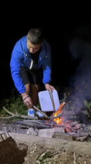 Campfire, fishing, and grilling by a Bulgarian lake at dusk