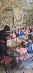 Traditional Bulgarian cooking demonstration draws children in Razhdavitsa