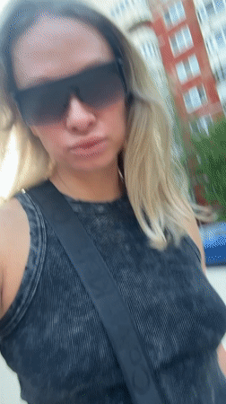 Woman records selfie video on street in Perm, Russia