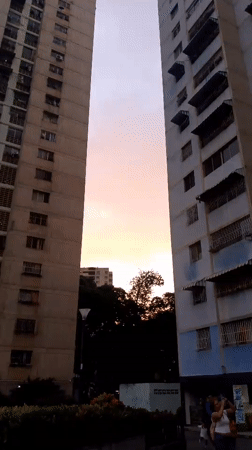 Evening life captured around Caracas apartment buildings and streets
