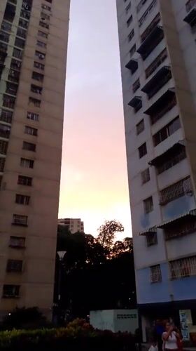 Evening life captured around Caracas apartment buildings and streets