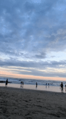 Beach twilight scene captured with colorful layered clouds