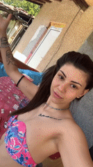 Woman and dog captured on patio in Bulgarian village